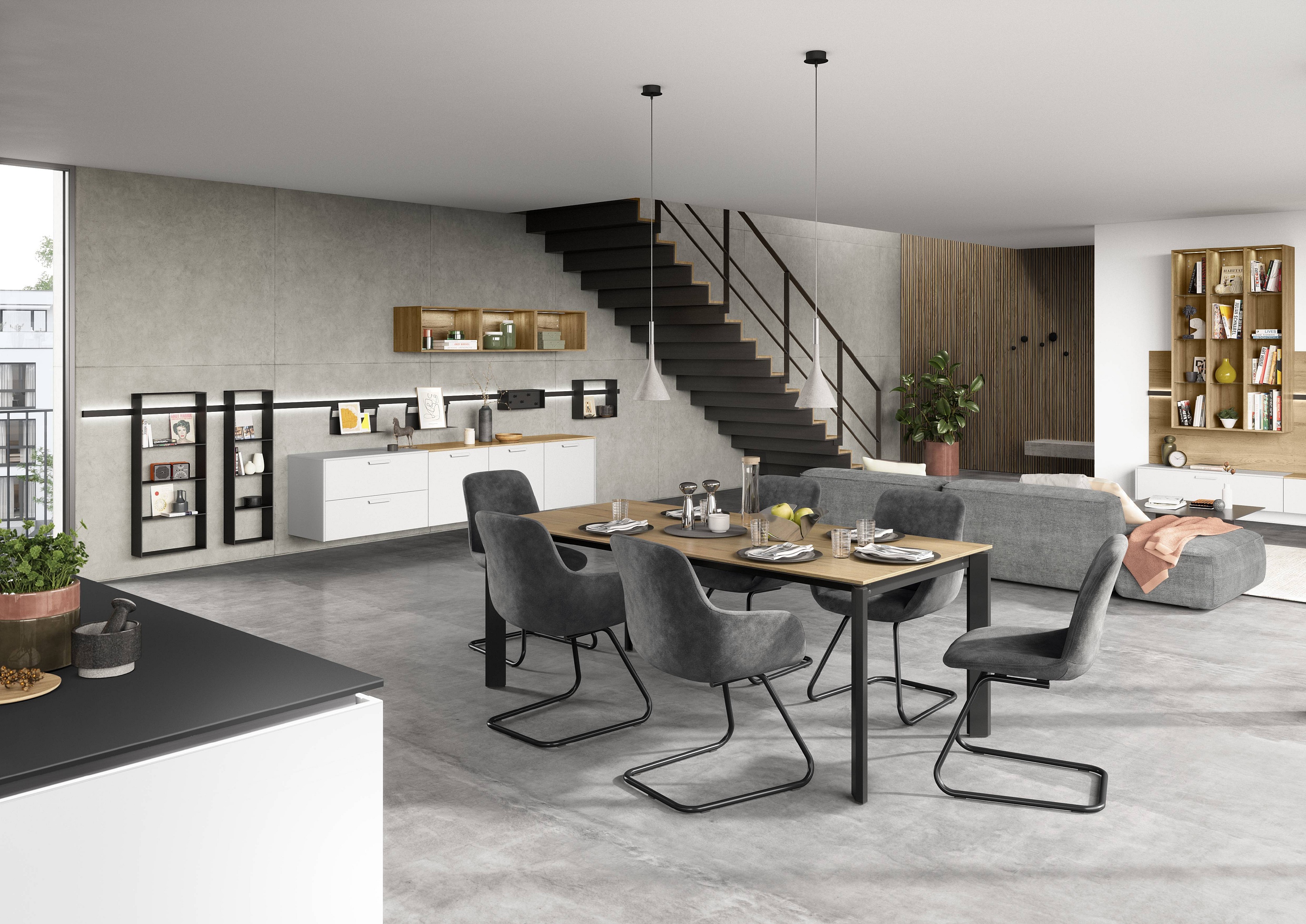 Essplatz in einer Wohnküche mit 6 grauen Polsterstühlen an einem Esstisch mit Holzplatte und schwarzen Metallbeinen Nobilia Artis